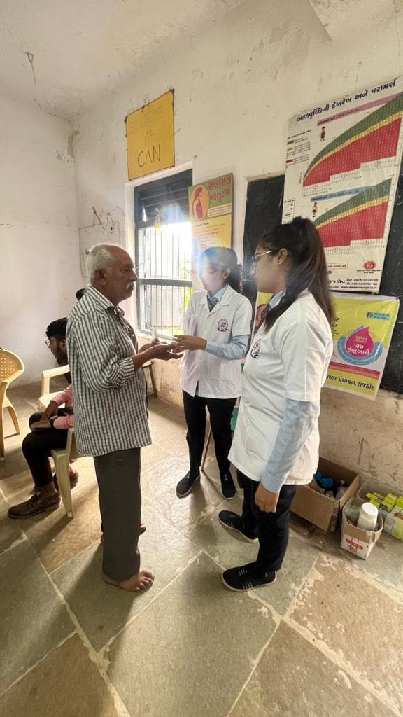 Kamdar Homoeopathic Medical College and Research Centre Rajkot Medical Camp photo 8