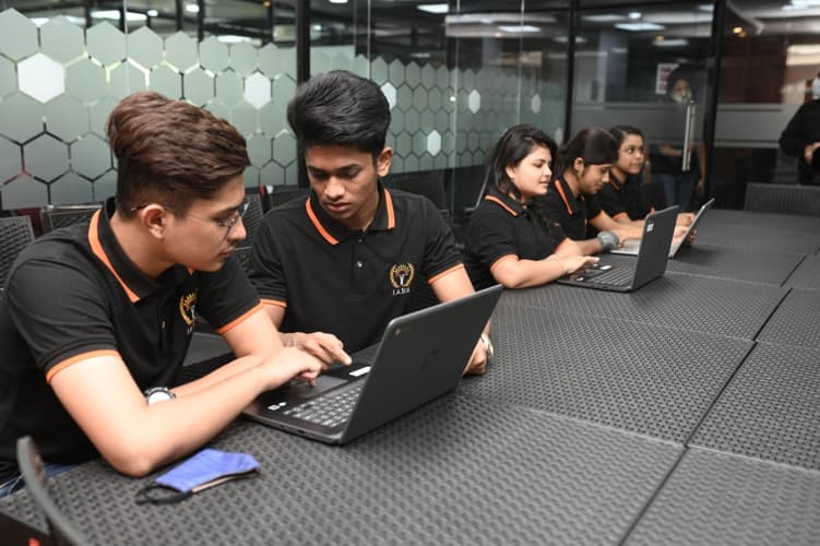 International Management & Analytics School Kolkata Student With Laptop photo 1