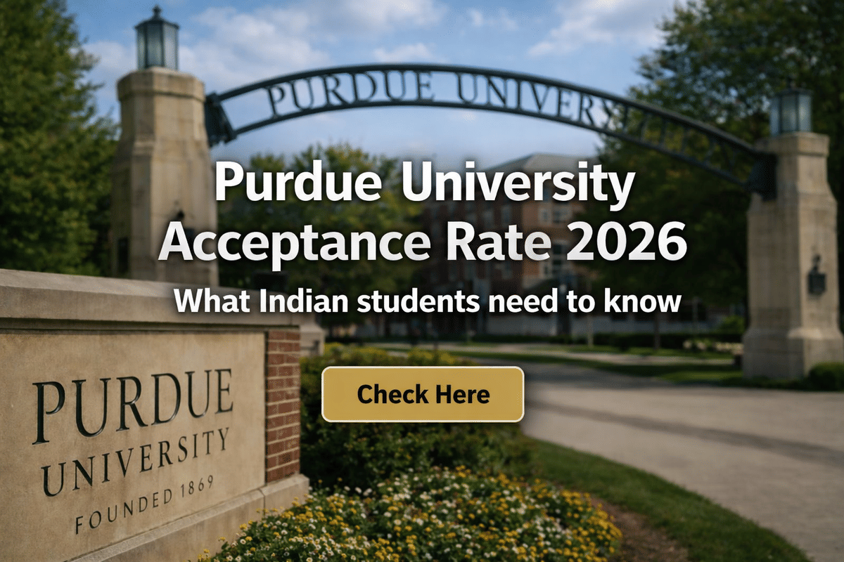 Promotional banner showing the entrance arch of Purdue University campus in the background. Large centered text reads &ldquo;Purdue University Acceptance Rate 2026,&rdquo; with a smaller subheading &ldquo;What Indian students need to know.&rdquo; A gold &ldquo;Check Here&rdquo; call-to-action button is placed below the text. The foreground includes a stone sign with &ldquo;Purdue University Founded 1869,&rdquo; surrounded by greenery and flowers, with a softly blurred campus scene behind for emphasis on the text.